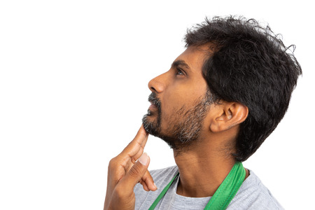 Thinking hypermarket or supermarket employee close-up with hand on the chin isolated on white studio...