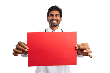 Friendly indian medic red paper as blank copyspace isolated on white studio backgroundの写真素材