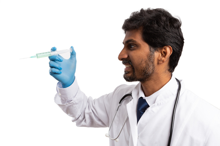 Smiling indian medic vaccinating blank copyspace isolated on white studio backgroundの写真素材