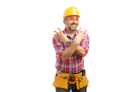 Friendly builder with eight fingers up and crossed arms as counting concept isolated on white...