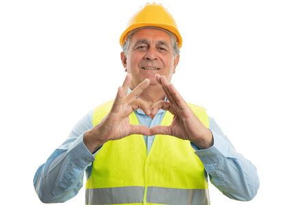 Old male builder with serious expression holding up four fingers as counting concept isolated on...