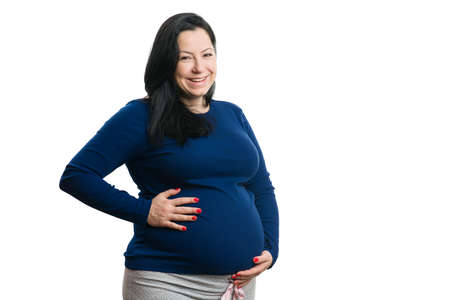 Smiling pregnant woman holding string with ultrasound pictures and red heart as love concept isolated on white background copyspaceの写真素材