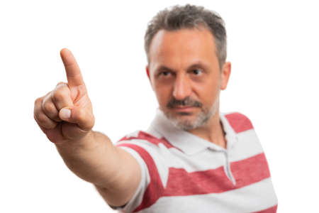 Selective focus close-up of casual male index finger touching invisible or transparent display blank copyspace for text advertising isolated on white studio backgroundの写真素材