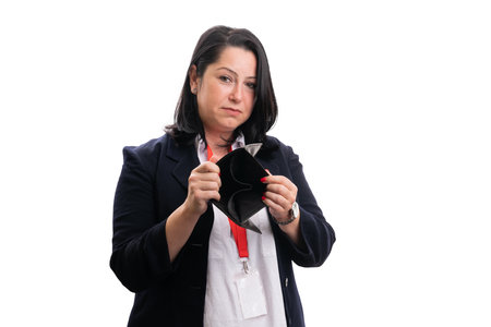 Poor female entrepreneut presenting empty wallet with sad expression wearing office clothin as...