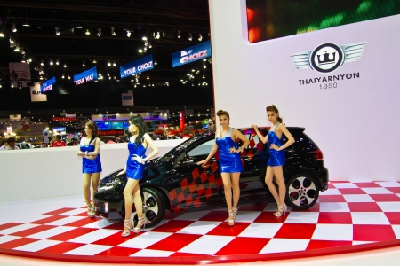 BANGKOK - MARCH 29: Female presenters model at the Volkswagen cars booth during Bangkok International Motor Show at Impact Challenger on March 29, 2013 in Bangkok, Thailandのeditorial素材