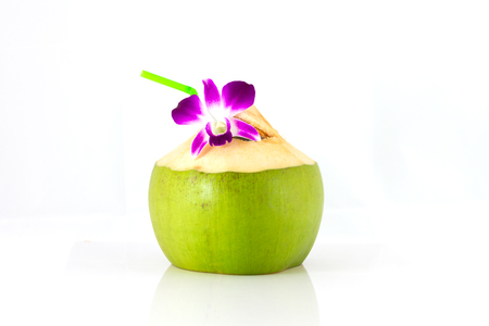 Serving coconut water and decorating orchid flowerの写真素材