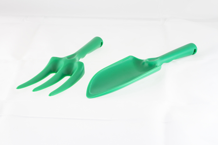 Green plastic shovel on white backgroundの写真素材