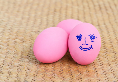 Pink preserved eggs on reed matの写真素材
