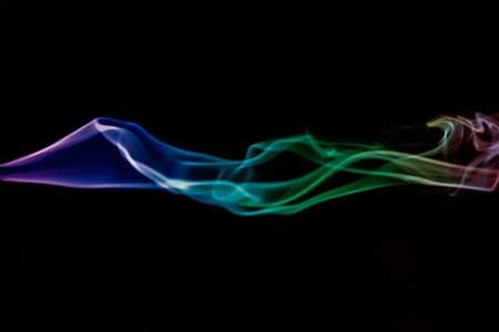 Colorful smoke abstract  on black backgroundの写真素材