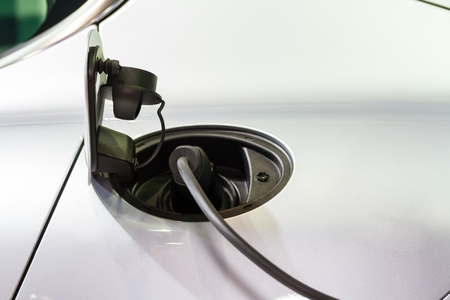 An electric car charging with the power cable supply plugged in,の写真素材