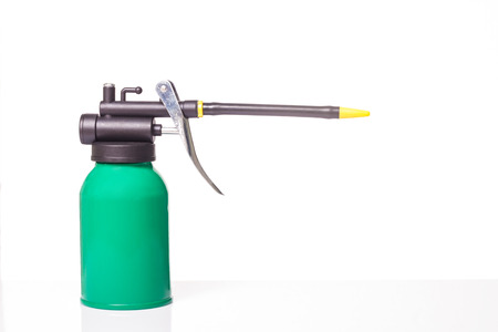 green oil can on white backgroundの写真素材