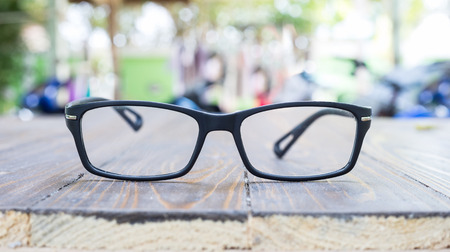 Old eye glasses on colorful bokeh backgroundの写真素材