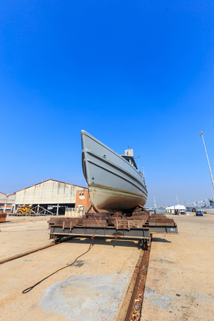 Military boat on synchrolift for repairingの写真素材