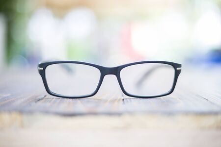 Old eye glasses on colorful bokeh backgroundの写真素材