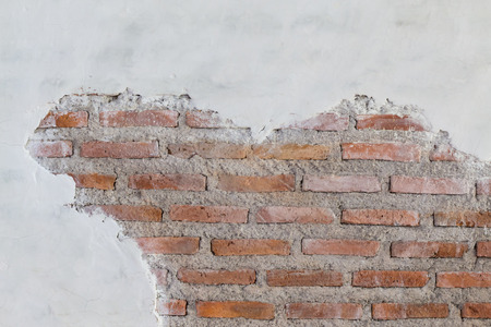 Old destroyed concrete and brick wallの写真素材