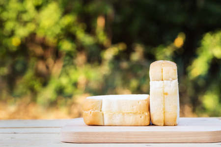 Bread on wooden floor with bokeh backgroundの写真素材