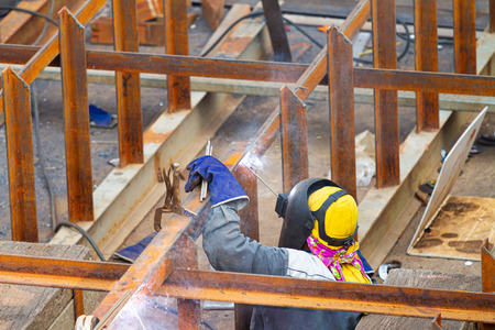 Industrial welder welding fabricated construction in factoryのeditorial素材