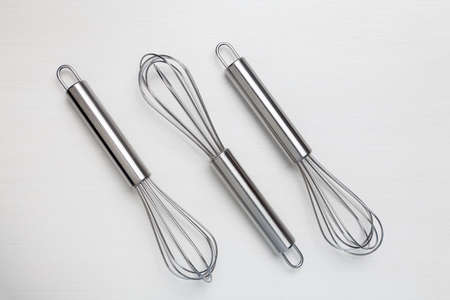 Stainless Steel Kitchen Whisk Egg Beater White Backgroundの写真素材