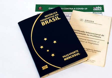 SOROCABA, SAO PAULO - MAY 16, 2022: Brazilian passport, international certificate of vaccination against yellow fever and vaccine card against covid nineteenのeditorial素材