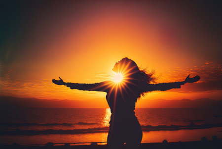 An image of a woman with her arms out and a sunsetの素材