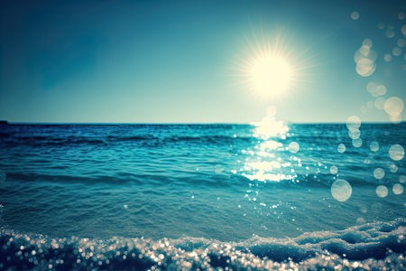 Beautiful natural bokeh of the sun shining over the waves of blueの素材