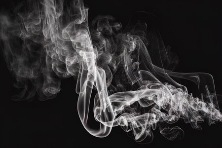 White smoke effect isolated on a black backgroundの素材