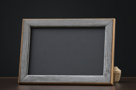 An empty board made of gray felt with a wooden frame. ROOM FOR TEXTの素材
