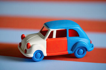 Toys of a retro miniature car variety printed on hip color paper. Imagination and pop art as a concept. The idea of time off whether for a holiday or any other reasonの素材
