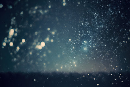 Background image of starry night sky. Image contains noise and grains due to high ISO and soft focus due to slow shutterの素材