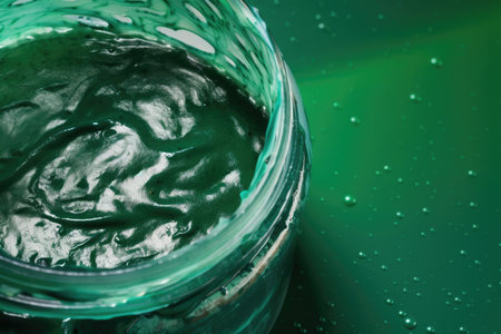 macro shot of a streaky, bubbly stain over a green background. a big banner with white space. Generative AIの素材