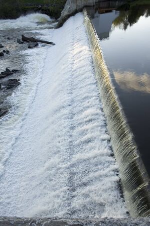 Waterfall over a damの写真素材