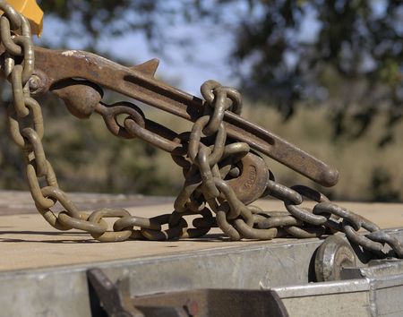 Chains hooking to a flatbed truckの写真素材