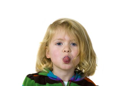 Young girl sticking out her tongue at youの写真素材