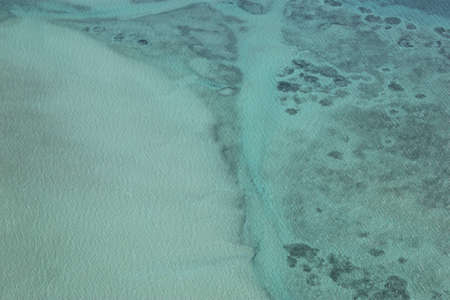 Ocean floor through blue waterの写真素材