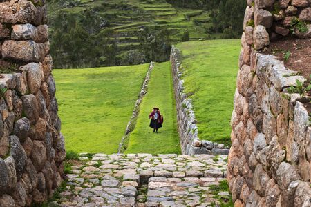 Chinchero, Peru - December 23, 2013: A Peruvian woman in the Inca Ruins in the village of Chinchero, in Peru.の写真素材