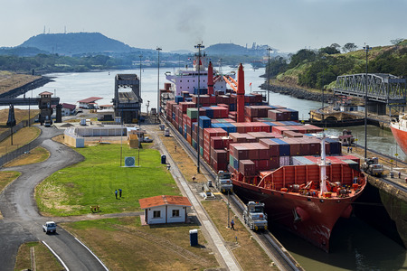 Panama Canal, Panama - March 3, 2014: A cargo ship entering the Miraflores Locks in the Panama Canal, in Panamaのeditorial素材