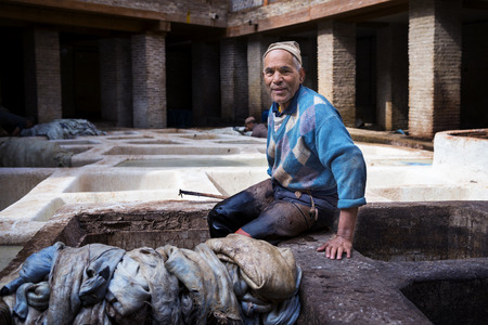 Fez, Morocco - April 11, 2016: One man working in a tannery in the city of Fez in Morocco.のeditorial素材
