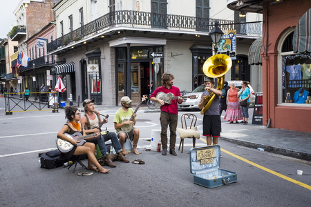 New Orleans, Louisiana, USA - June 17, 2014: Street musicians playing in a street of the French Quarter in the city of New Orleans, Louisiana.のeditorial素材