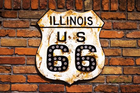 Rusty Route 66 Road Sign in a brick wall in the State of Illinois, USAの写真素材