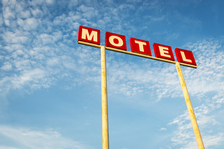 Motel Sign against a blue sky along the Route 66, USA; Concept for travel in America and Road Tripの写真素材