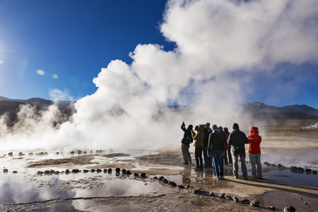 Geysers del Tatio, Chile - November 24, 2013: Tourists watching a geyser in the Geysers del Tatio field in the Atacama Desert, Northern Chileのeditorial素材