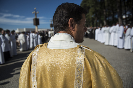 Fatima, Portugal - May 13, 2014: Priest at the Sanctuary of Fatima during the celebrations of the apparition of the Virgin Mary in Fatima, Portugal.のeditorial素材