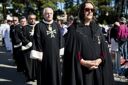 Fatima, Portugal - May 13, 2014: Knights of the Order of Malta at the Sanctuary of Fatima during the celebrations of the apparition of the Virgin Mary in Fatima, Portugal.のeditorial素材