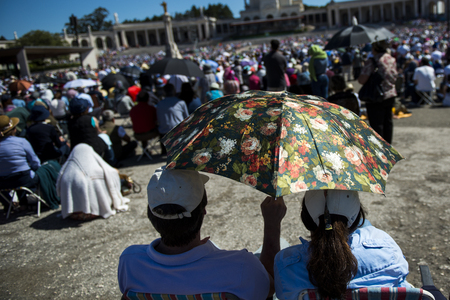 Fatima, Portugal - May 13, 2014: Crowd of people at the Sanctuary of Fatima during the celebrations of the apparition of the Virgin Mary in Fatima, Portugal.のeditorial素材