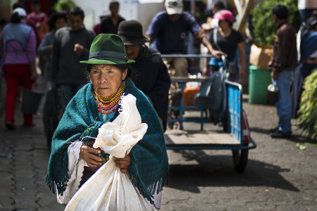 Otavalo, Ecuador - February 1, 2014: Indigenous woman in a market  the town of Otavalo in Ecuador.のeditorial素材