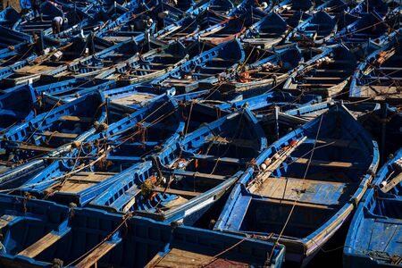 Traditional blue fishing boats in the harbour of Essaouira in Morocco, North Africaの写真素材
