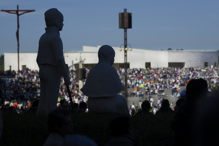 Fatima, Portugal - May 13, 2014: Silhouete of the images of the litle shepherds at the Sanctuary of Fatima during the celebrations of the apparition of the Virgin Mary in Fatima, Portugal.のeditorial素材