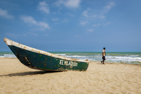 Palomino, Colombia - March 13, 2014: Man walking in the Palomino Beach in the Caribbean Coast of Colombia, South Americaのeditorial素材