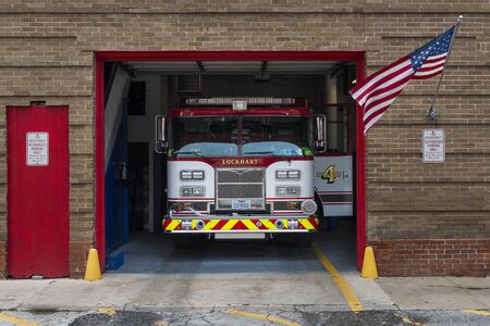 Lockhart, Texas - June 6, 2014: A Fire Truck in its garage in the Lockhart Fire Department in the city of Lockhart, Texas, USAのeditorial素材