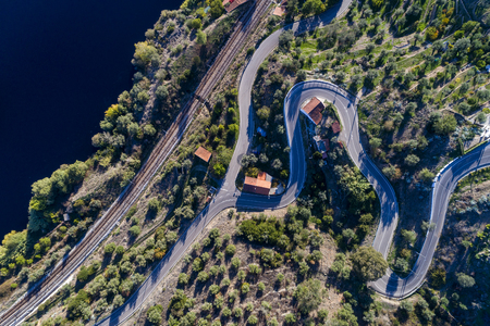 Aerial view of a winding road and train tracks along the Tagus River near the village of Belver in Portugal; Concept for travel in Portugalの写真素材